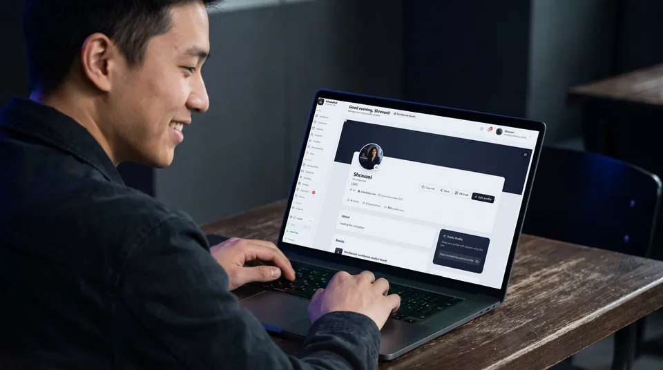 A laptop showing a SchedulifyX public profile page with a shareable link and QR code.